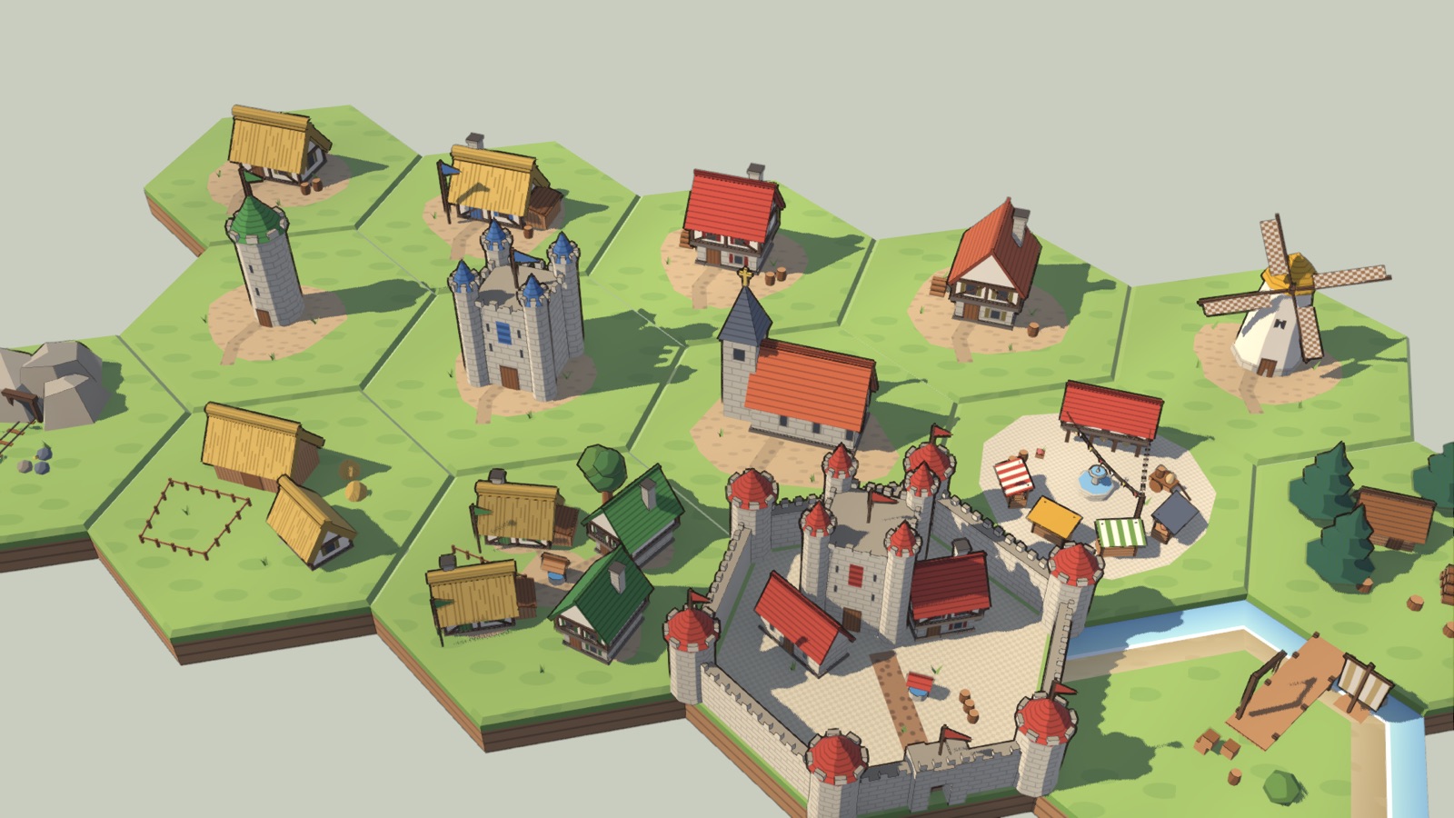 The buildings on a board of hexes: cottages, a windmill, towers, a chapel, a market and a castle.